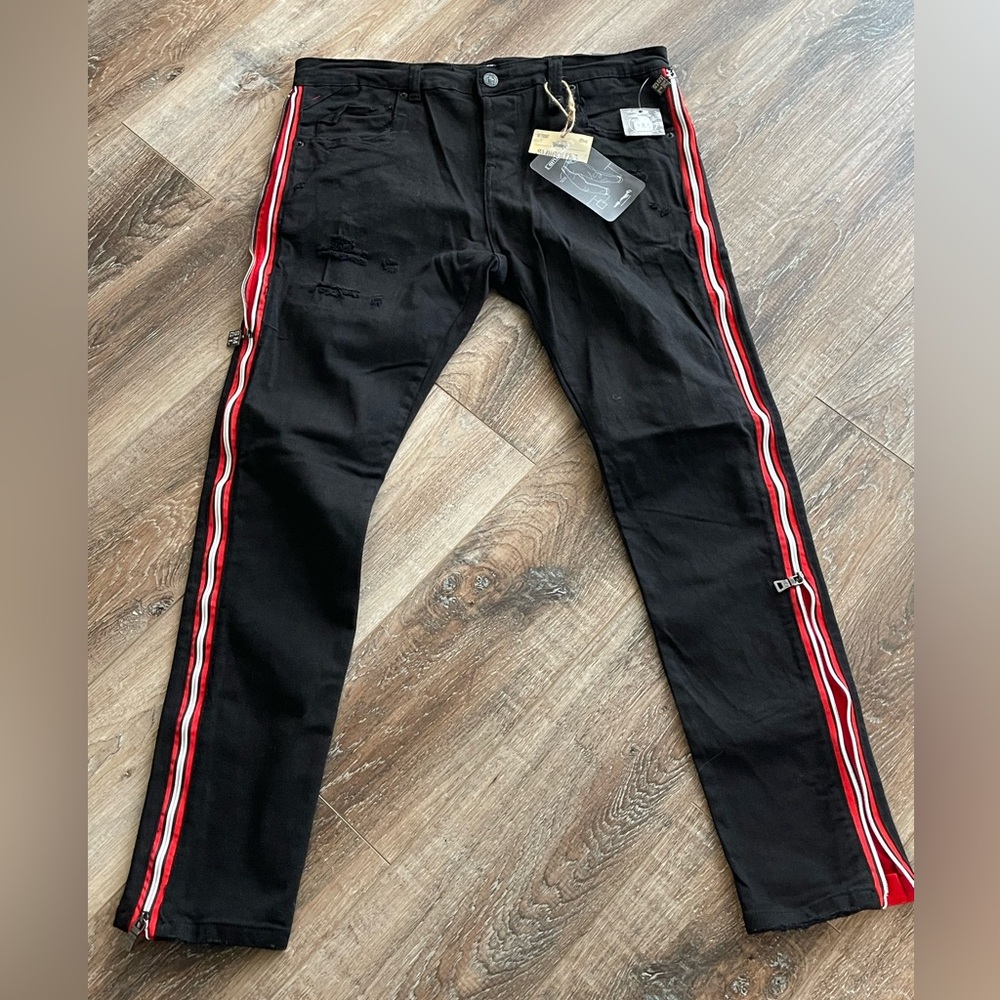 Black smugglers moon ripped denim with red side stripe 38x33 NWT